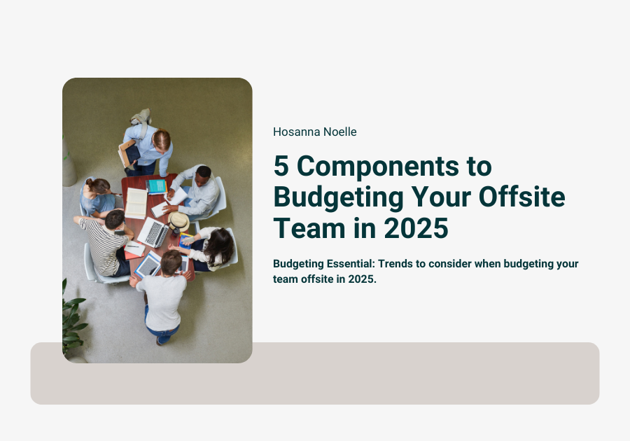 Team of professionals collaborating during an offsite meeting with laptops and presentation materials in a modern conference venue